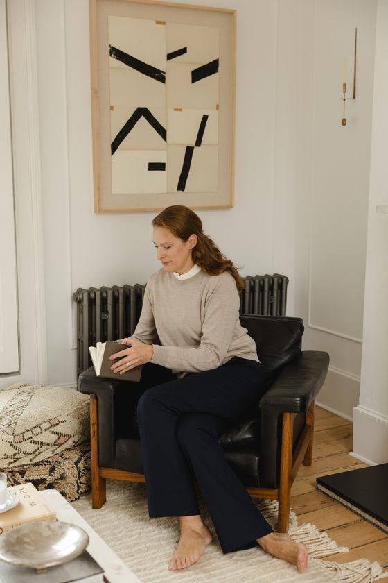 Anastasia Roumelioti reading an open notebook